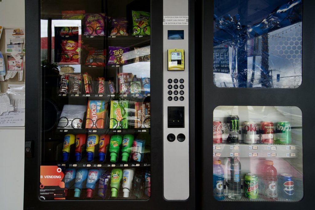 Vending machines stocked with snacks, drinks, and laundry detergent at The Laundry Hub in San Francisco