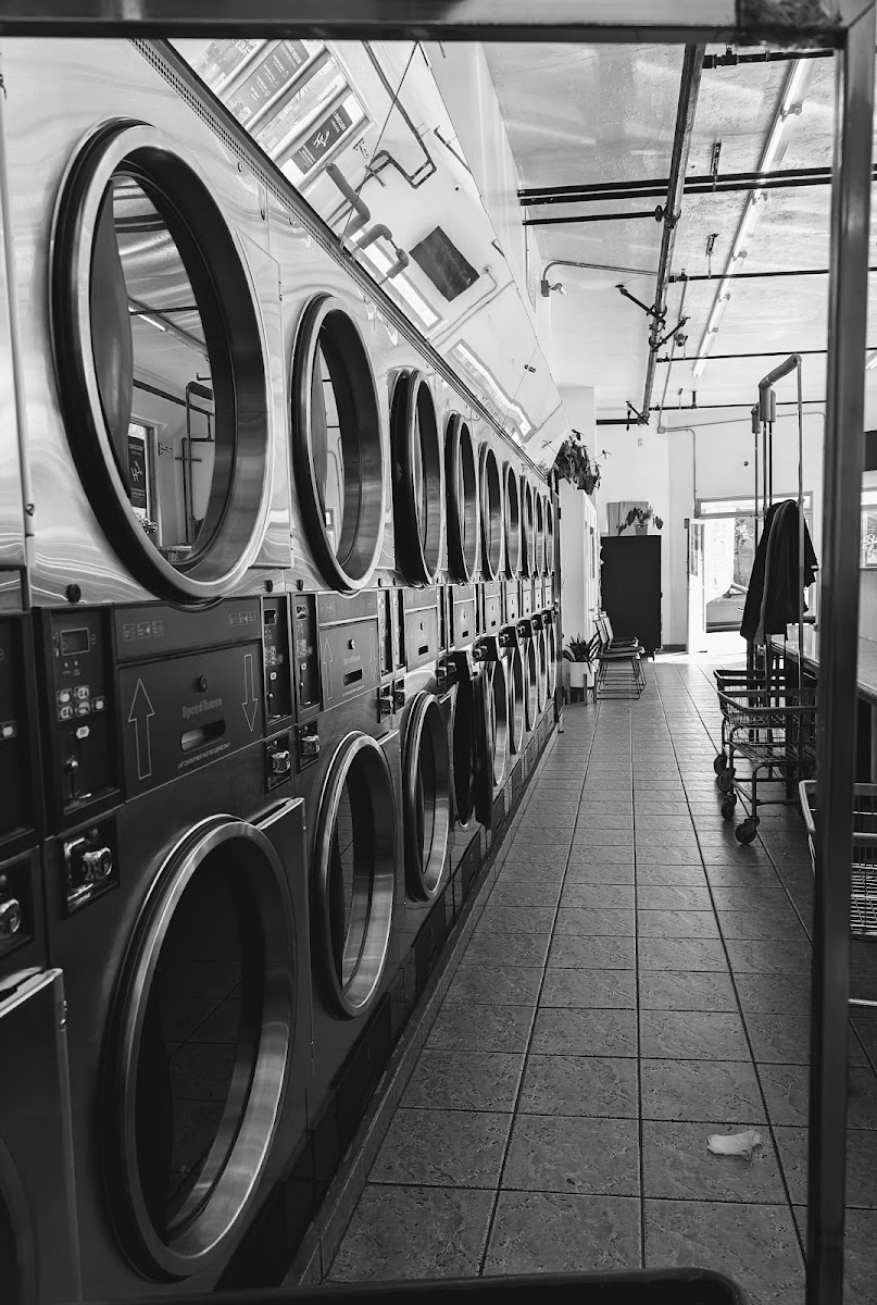 Row of stacked dryers at The Laundry Hub SF laundromat