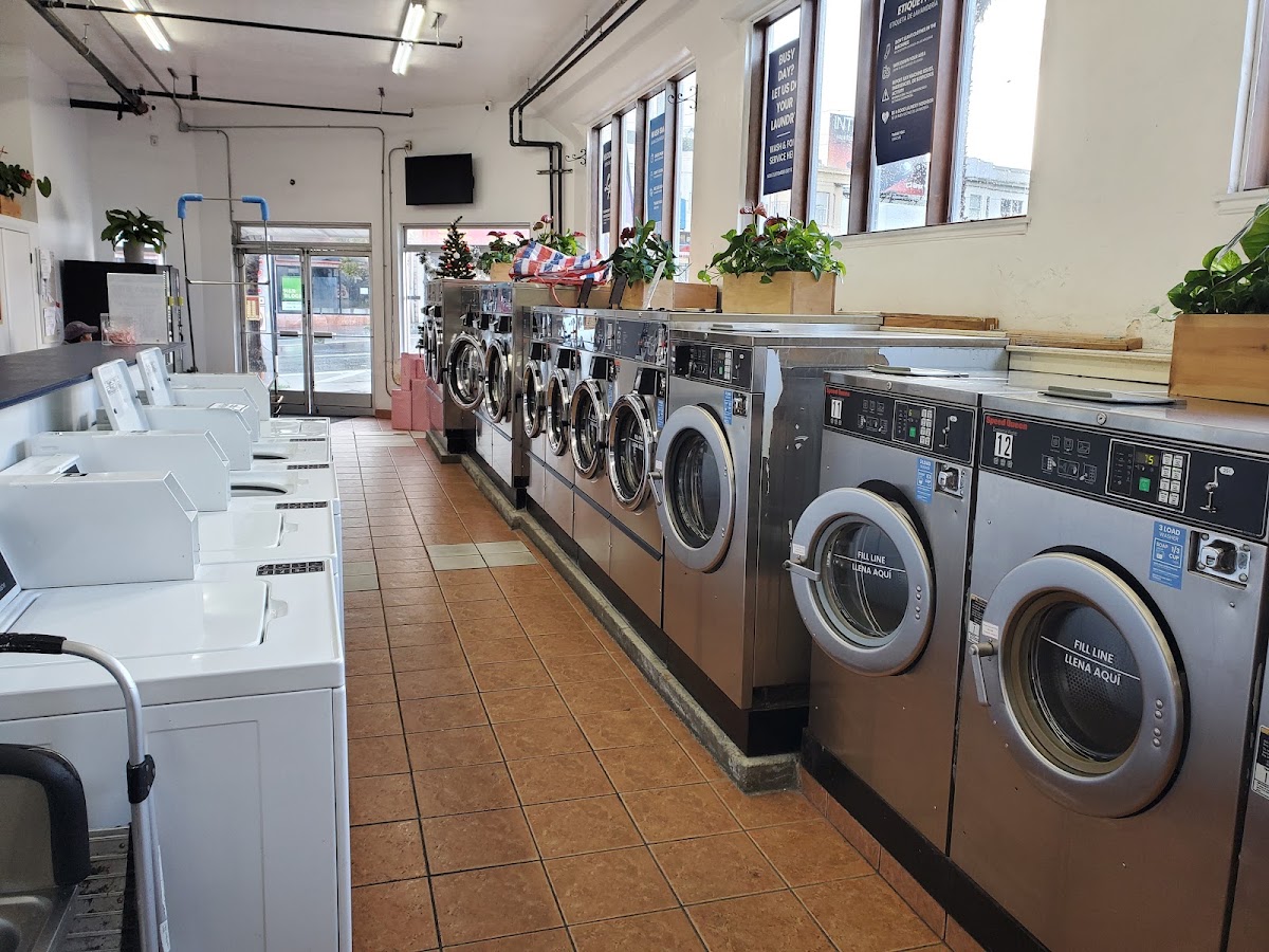 Folding area and washing machines at The Laundry Hub SF
