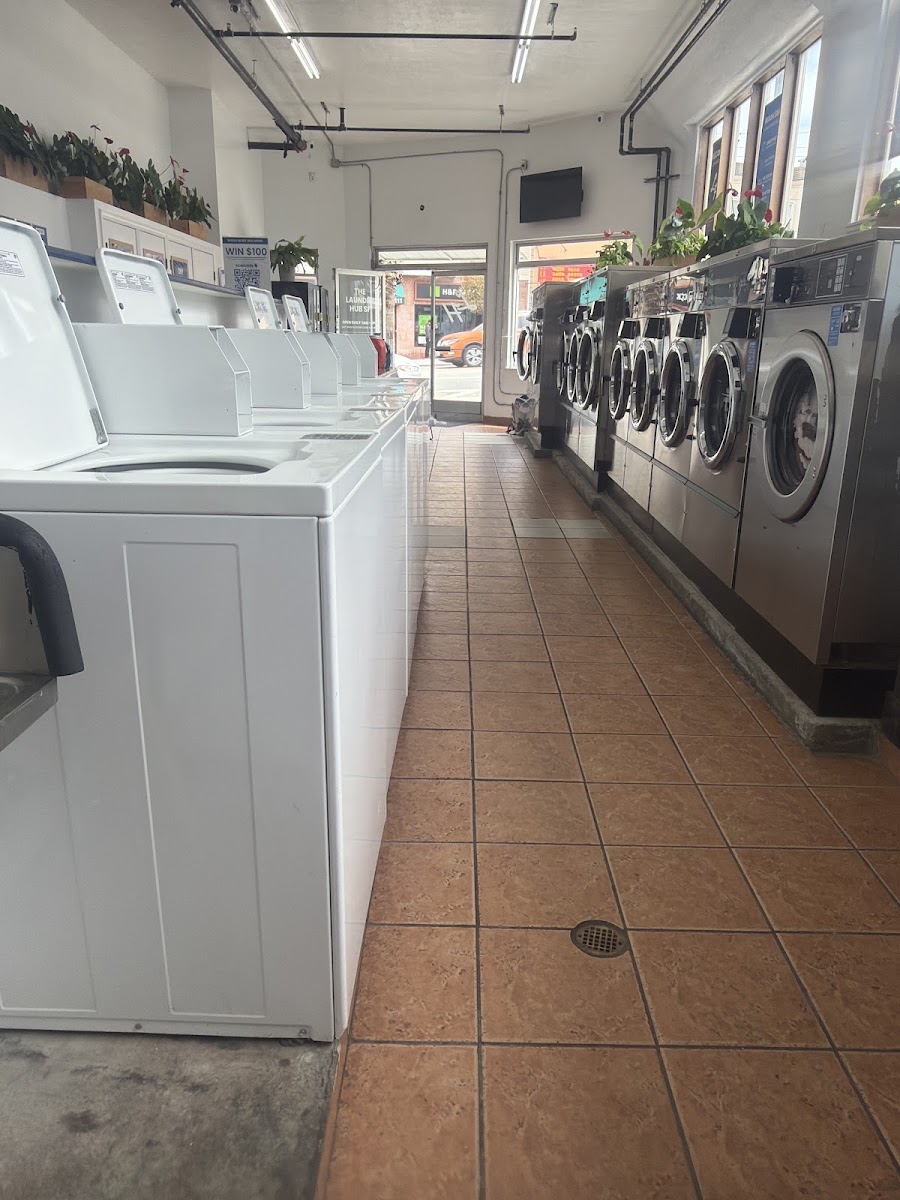 Interior aisle between washers and dryers at The Laundry Hub SF