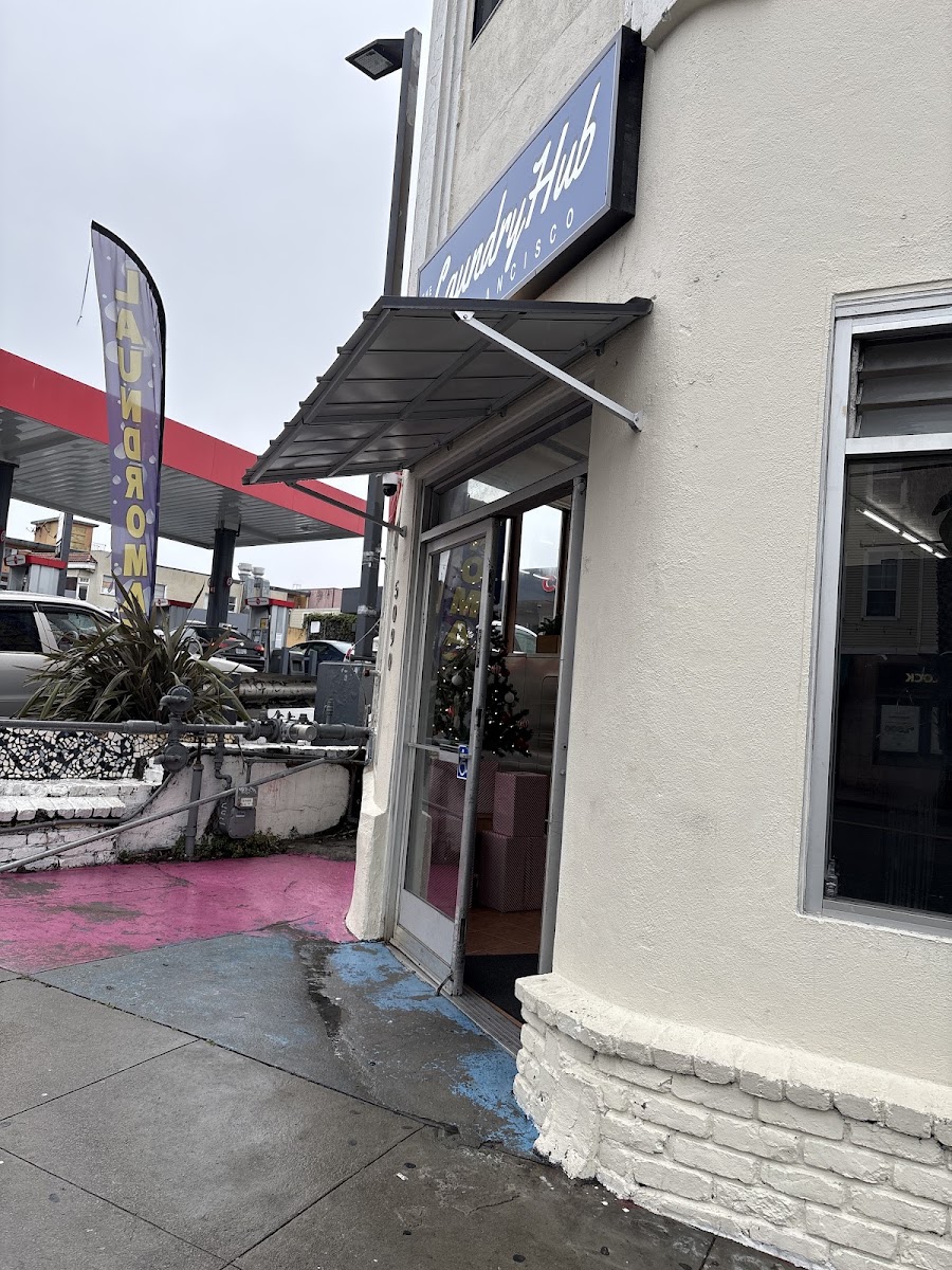 Entrance to The Laundry Hub SF laundromat on Mission Street, San Francisco